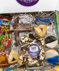 Happy Purim Box with kosher snacks, chocolates, cookies, and hamentashen for festive celebrations.