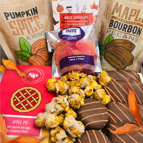 Autumn Assortment Box featuring Pumpkin Spice Almonds, Maple Bourbon Pecans, Apple Pie Chocolate, and fall-themed gourmet treats.