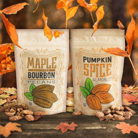 Maple Bourbon Pecans and Pumpkin Spice Almonds surrounded by autumn leaves