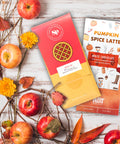 "Autumn Assortment Box with Apple Pie Chocolate and Pumpkin Spice Latte White Chocolate surrounded by fall decorations"