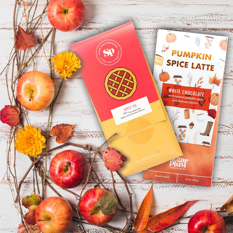 "Autumn Assortment Box with Apple Pie Chocolate and Pumpkin Spice Latte White Chocolate surrounded by fall decorations"