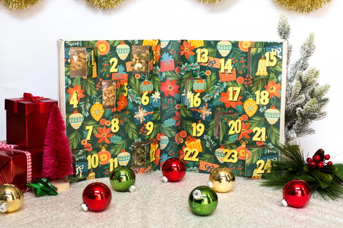 "2024 Gourmet Nuts & Snacks Advent Calendar with festive design and holiday decor, featuring 24-day countdown with premium treats"