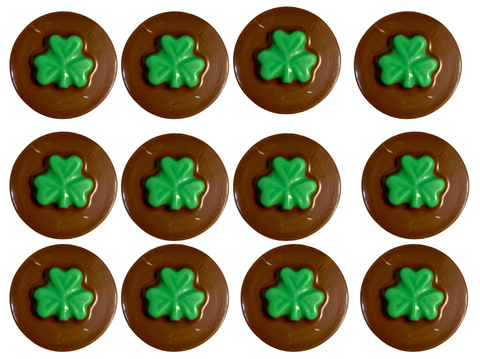 Twelve chocolate-covered sandwich cookies with green shamrocks for St. Patrick's Day.