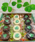 Festive St Patrick's Day chocolate covered sandwich cookies with green shamrock design in gift box, individually wrapped.