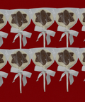 Set of 10 Milk and White Chocolate Snowflake Lollipops with White Bows on Red Background for Christmas Gifting