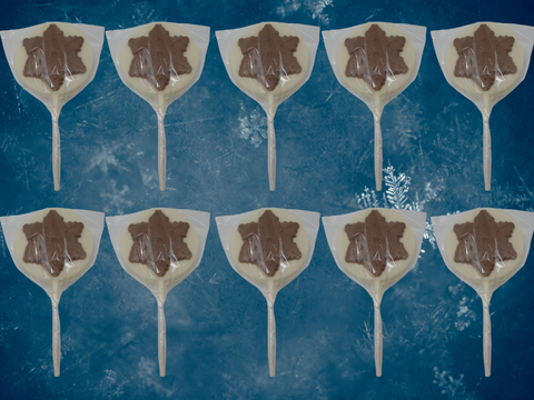 Milk and white chocolate snowflake lollipops with white bows, set of 10, perfect for holiday gifting or stocking stuffers.