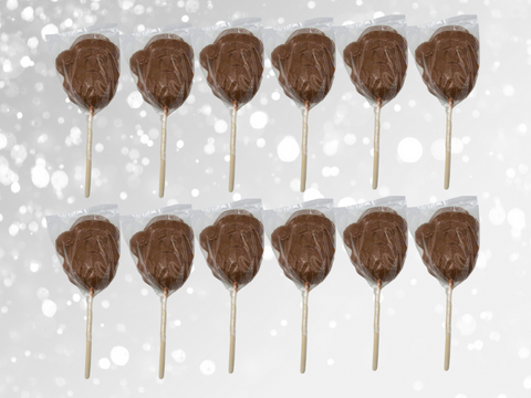 Set of 12 handcrafted milk chocolate Santa lollipops with festive red bows, perfect for Christmas stocking stuffers.