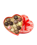 Heart-shaped box of 12 gourmet truffles with assorted chocolate flavors, perfect for Valentine's Day gift.