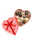 Heart-shaped box of Valentine's Day truffles with an assortment of white, dark, and milk chocolate flavors.