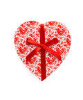 Heart-shaped gift box with red ribbon, perfect for Valentine's Day chocolates or truffles.