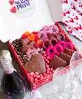 Valentine's Day Box with chocolate-covered treats, candies, and wine, perfect for a romantic celebration.