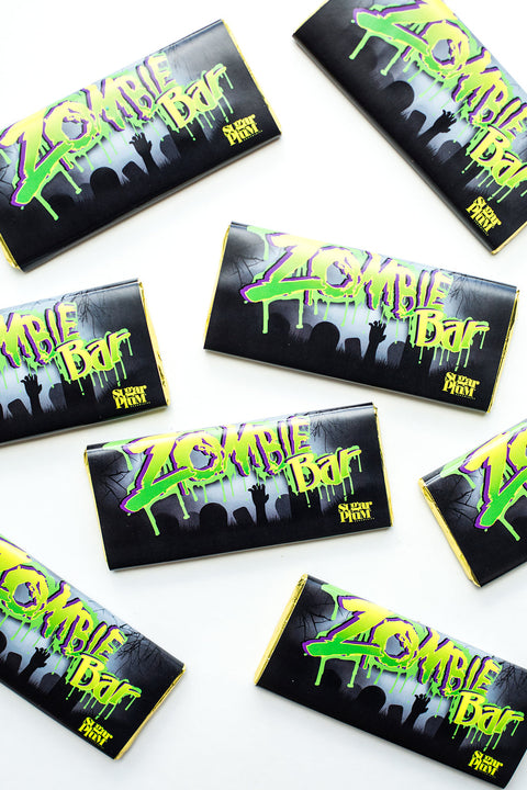 Chocolate Zombie Bar set, premium white chocolate with crispies, spooky Halloween candy in black packaging with green lettering.