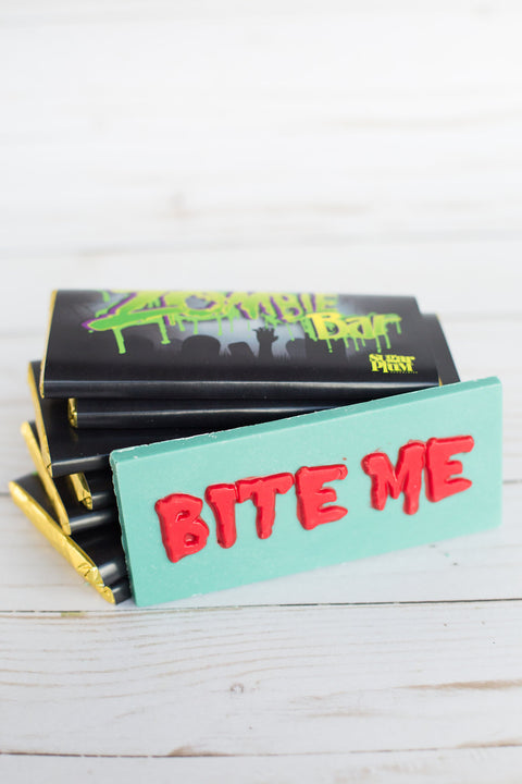 Handcrafted Chocolate Zombie Bar with "Bite Me" text, spooky green white chocolate with crispies, Halloween party candy.